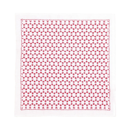 a square-shaped fabric with a repeating pattern of red stars on a white background.