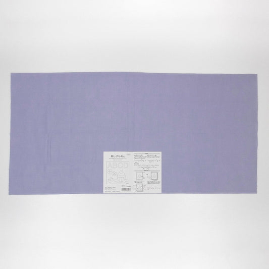 The image is a large purple fabric or cloth, with a small white label or instruction sheet attached to it.