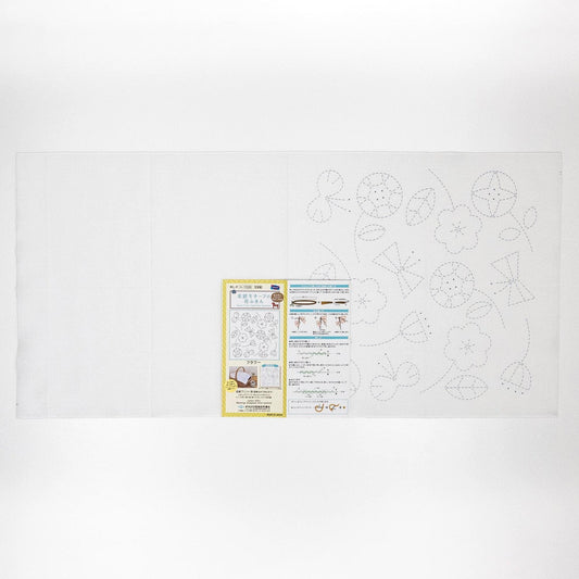 The image is a white sheet of paper with various patterns and designs, including flowers and leaves, as well as some text and illustrations.