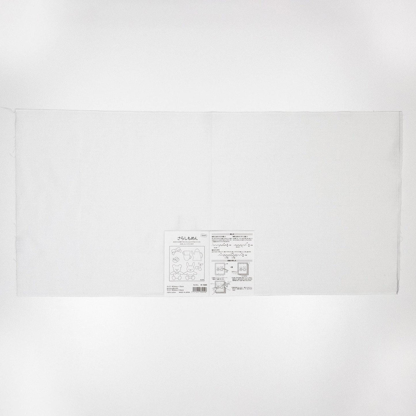 The image is a plain white sheet of paper or card with some text and diagrams on it.