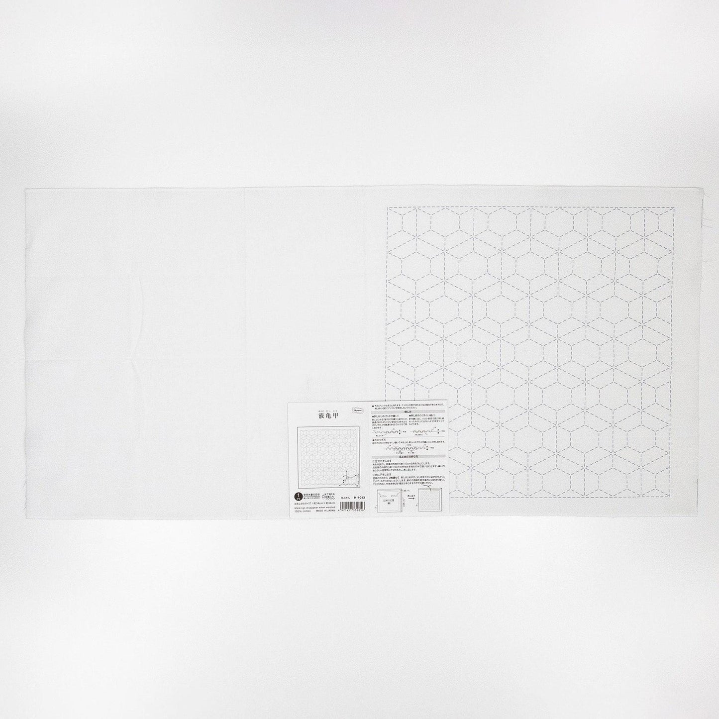 The image is a plain white sheet of paper with a geometric pattern on it.