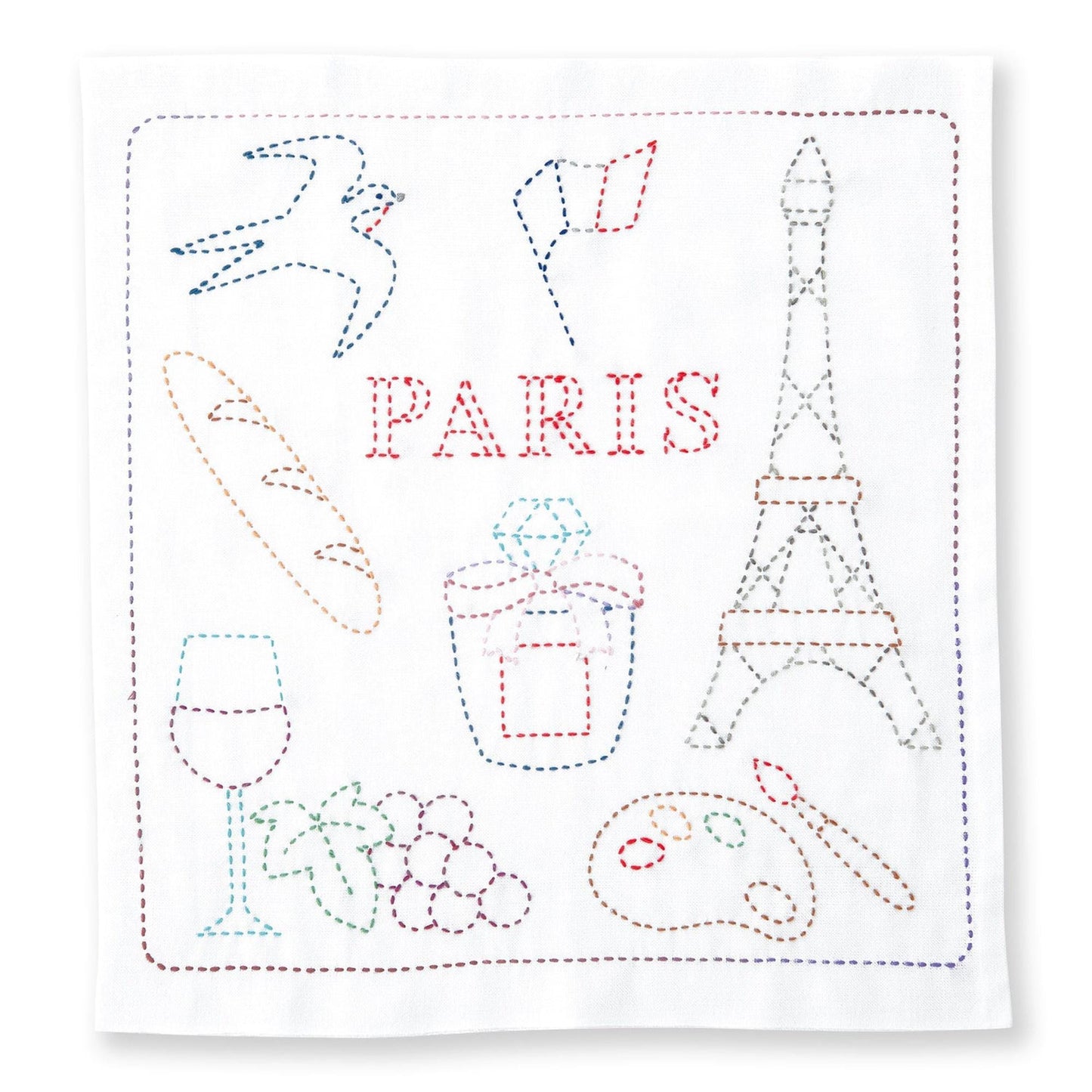 The image is a hand-stitched embroidery featuring various objects and symbols associated with Paris, including a bird, a flag, a tower, a wine glass, grapes, and a paint palette.