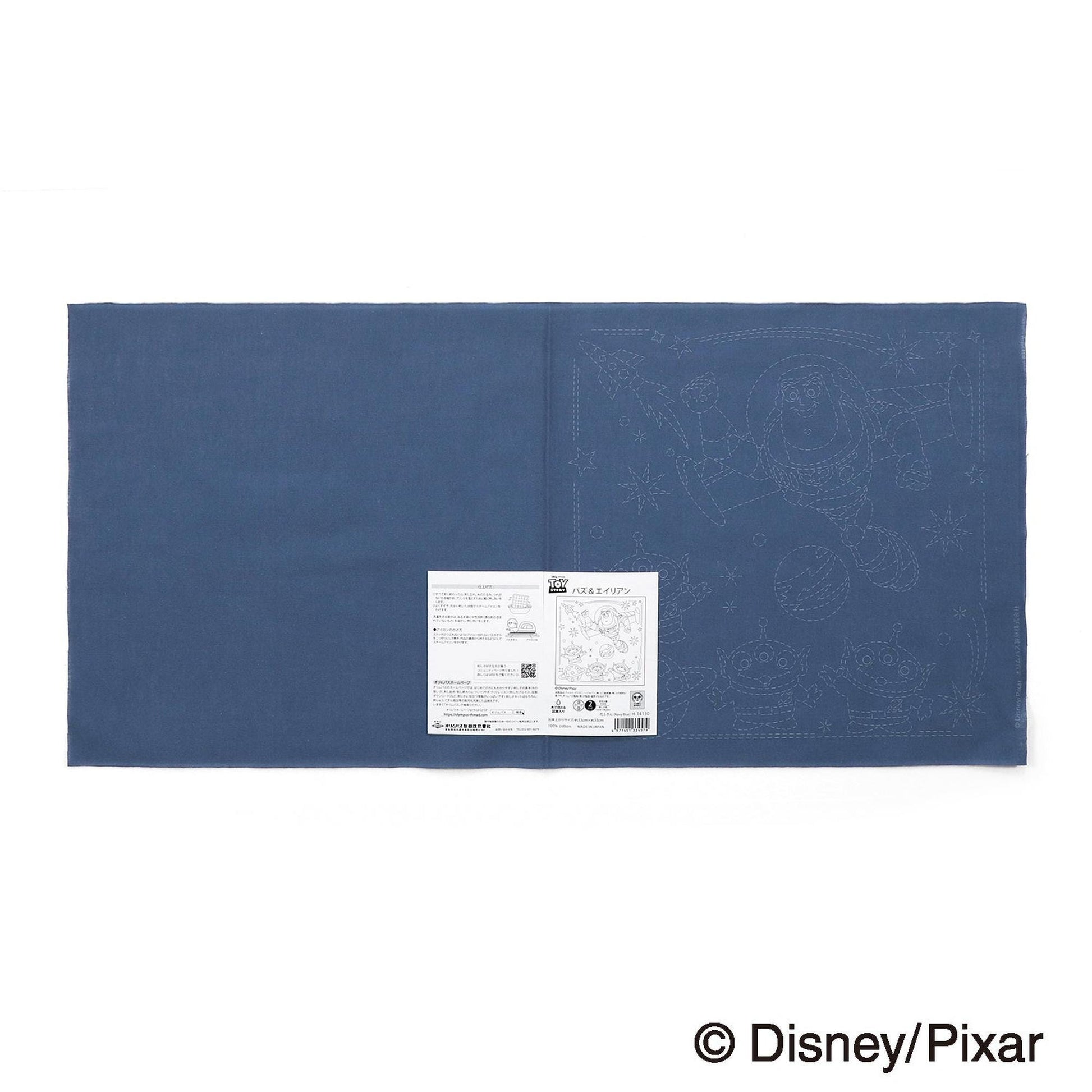 The image is a blue fabric with a white label attached to it, which appears to be a product label or instructions.