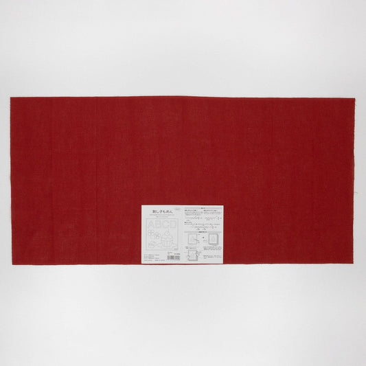 The image is a large red fabric or cloth with a white label or tag attached to it, which appears to be a product or packaging.