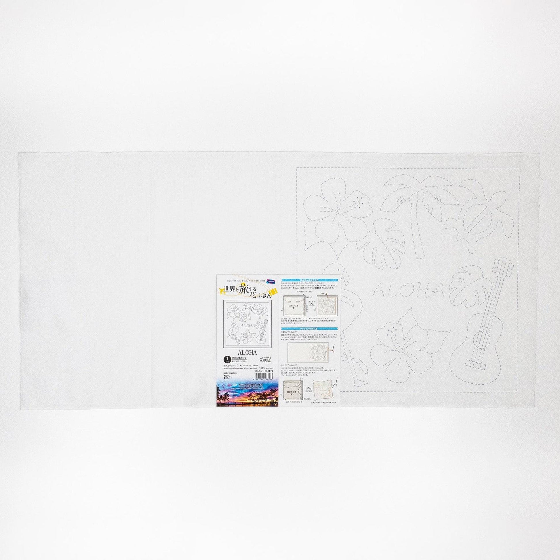 The image is a white sheet of paper with various drawings and text, including a large drawing of a guitar and the word "ALOHA" written on it.