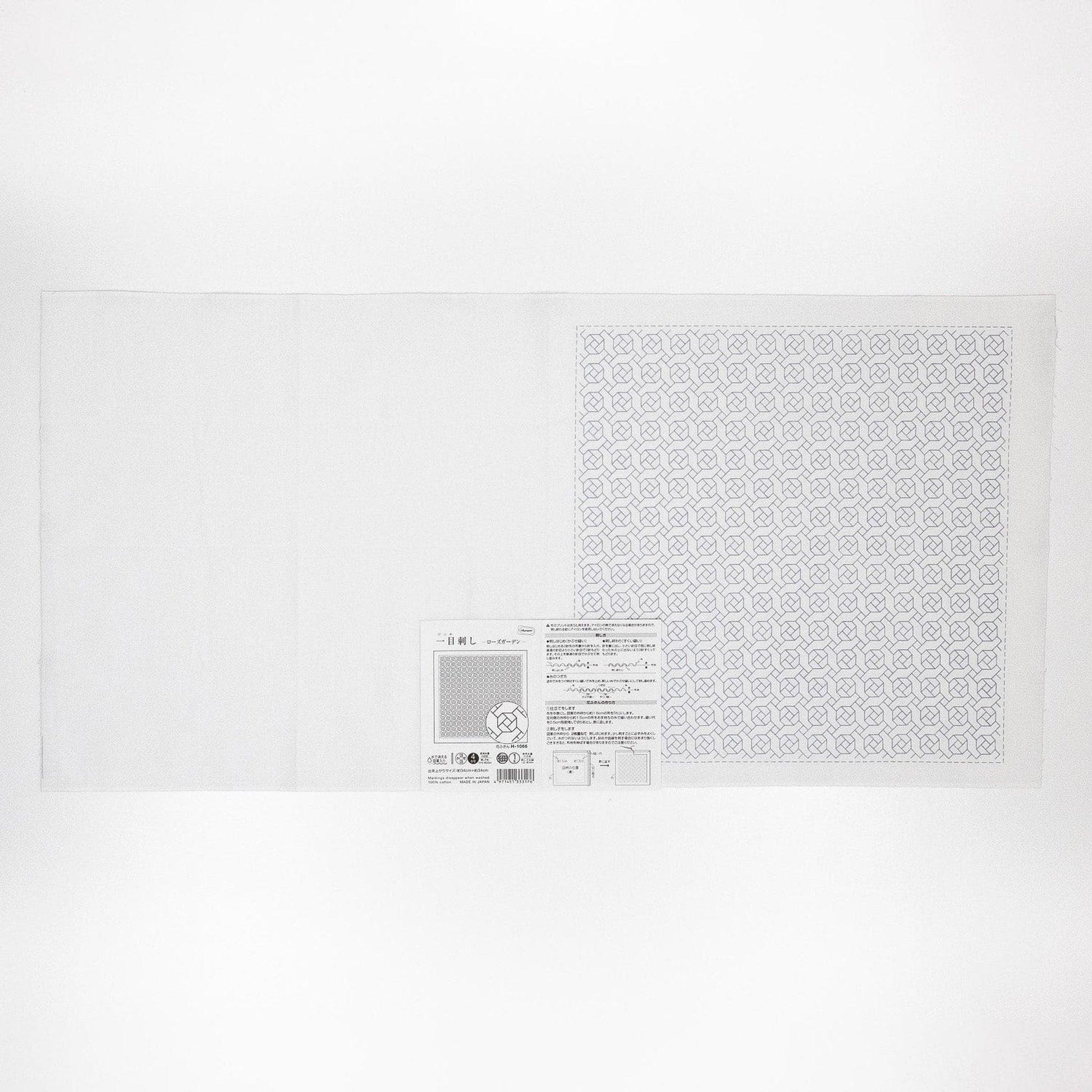 The image is a white sheet of paper with a patterned square on it.