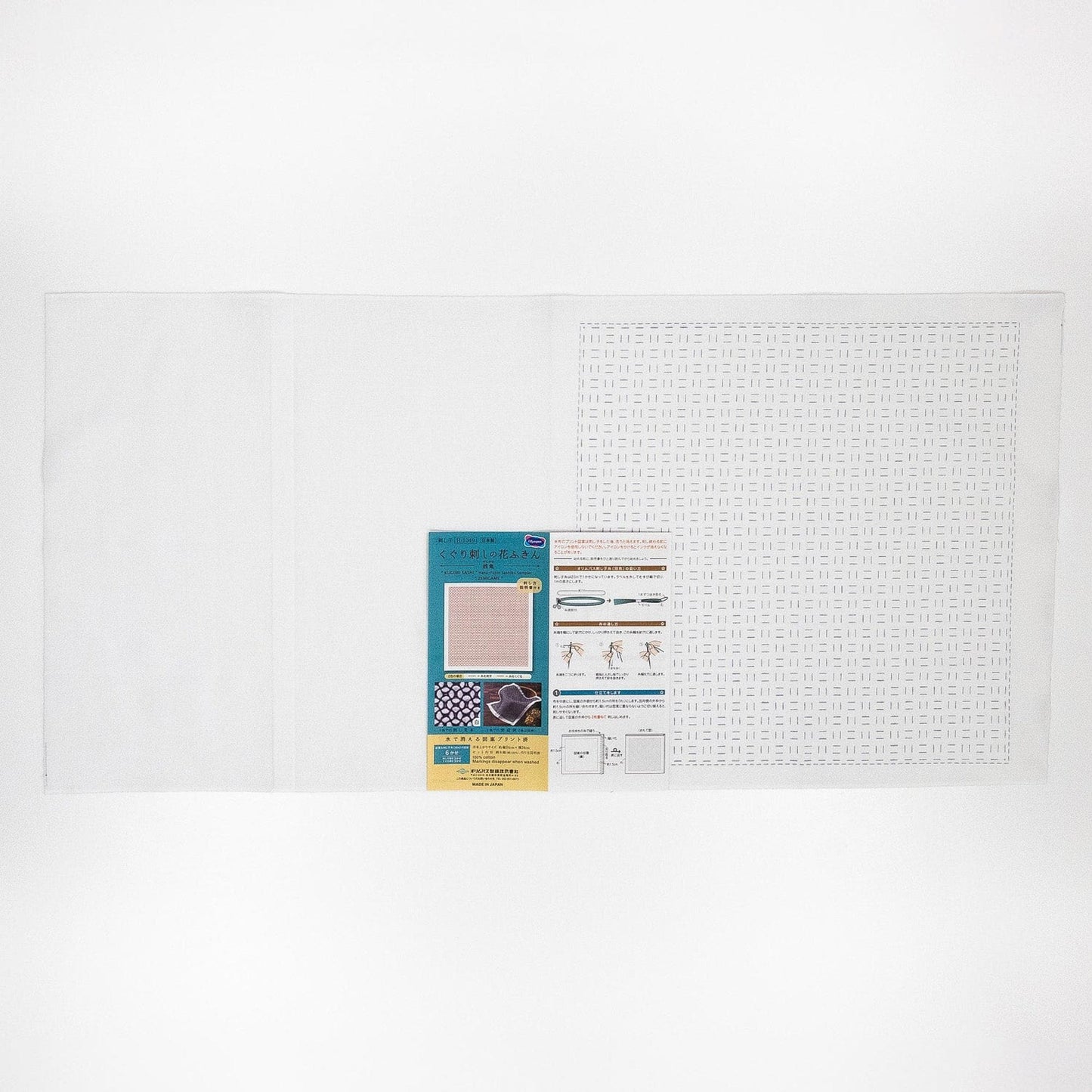 The image is a plain white background with a printed material, possibly a label or informational sheet, placed on the right side.