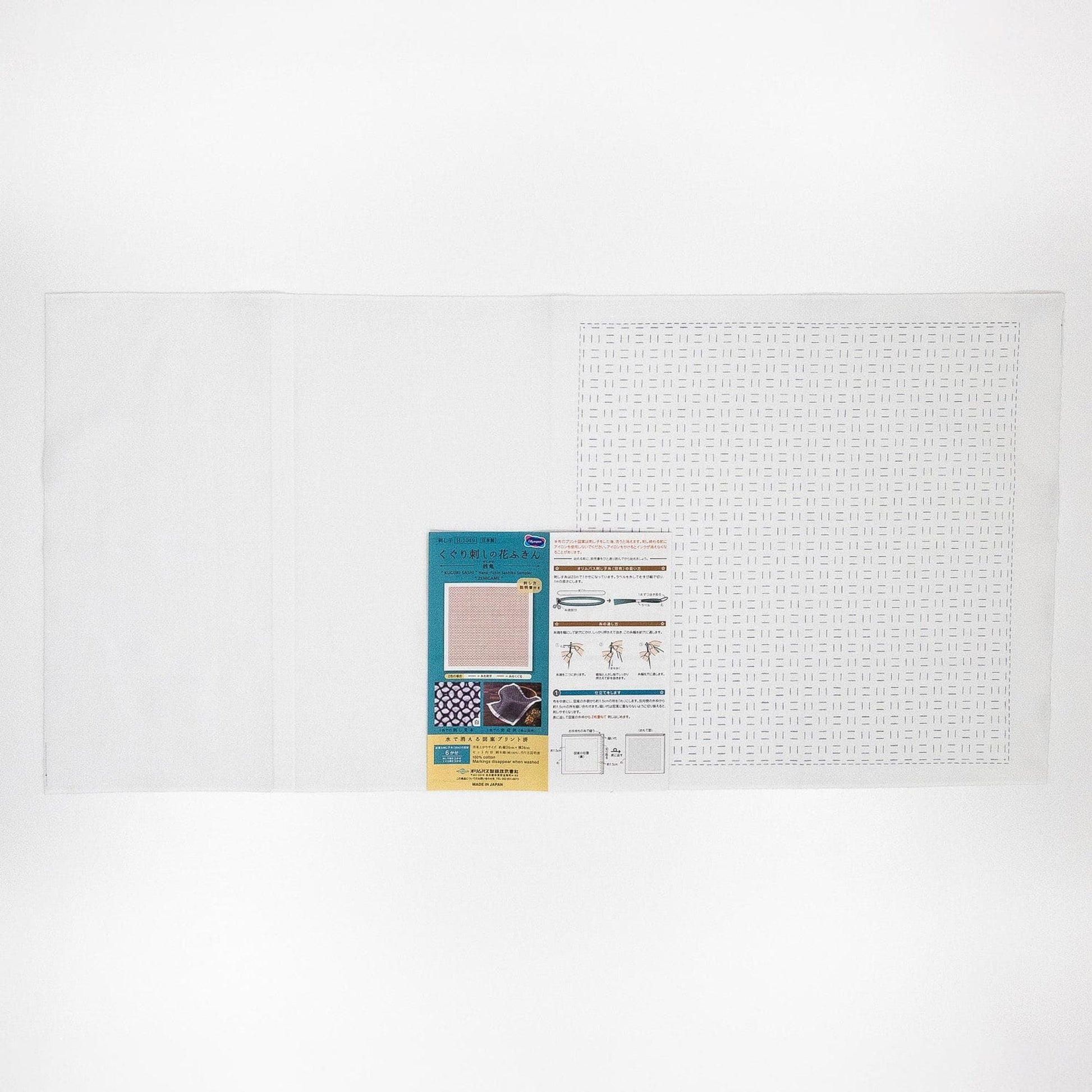 The image is a plain white background with a printed material, possibly a label or informational sheet, placed on the right side.
