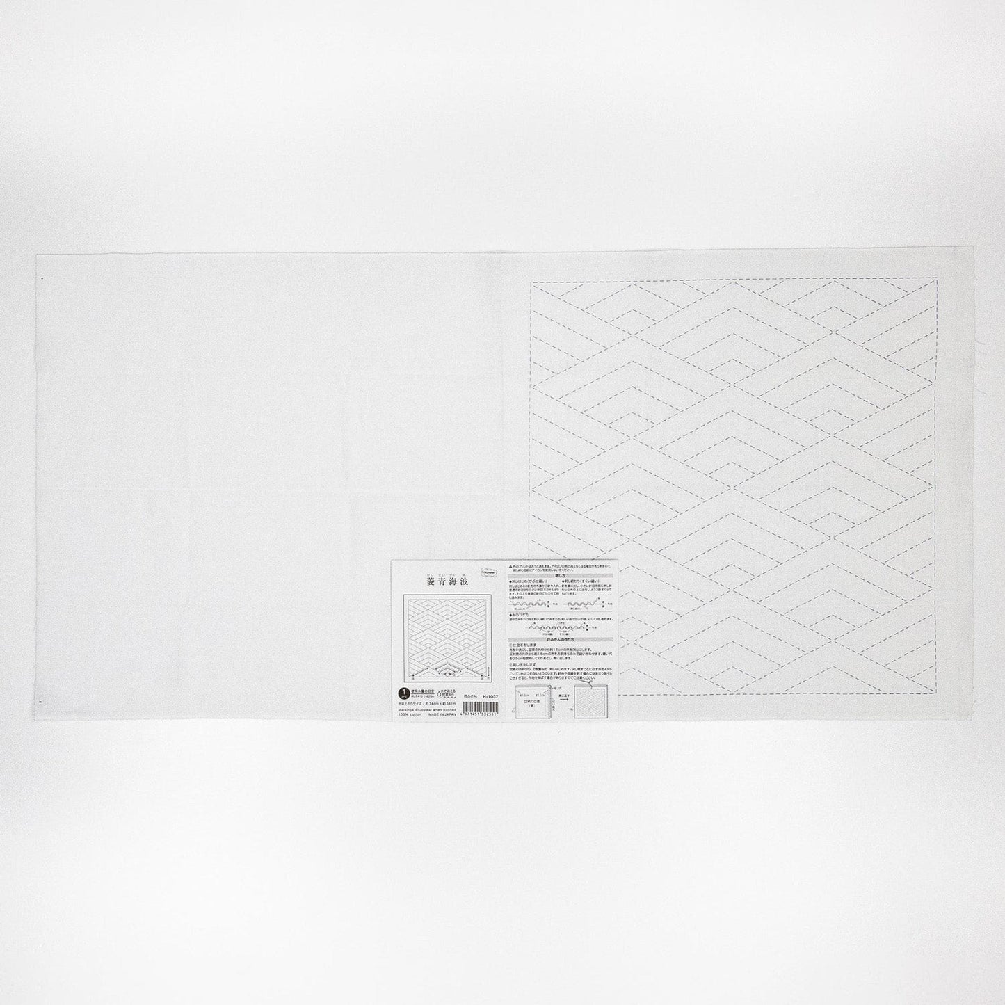 The image is a plain white sheet of paper with a geometric pattern on it.