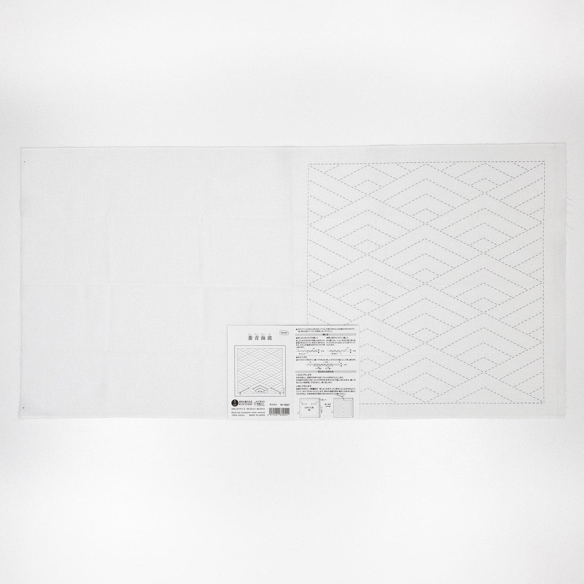 The image is a plain white sheet of paper with a geometric pattern on it.