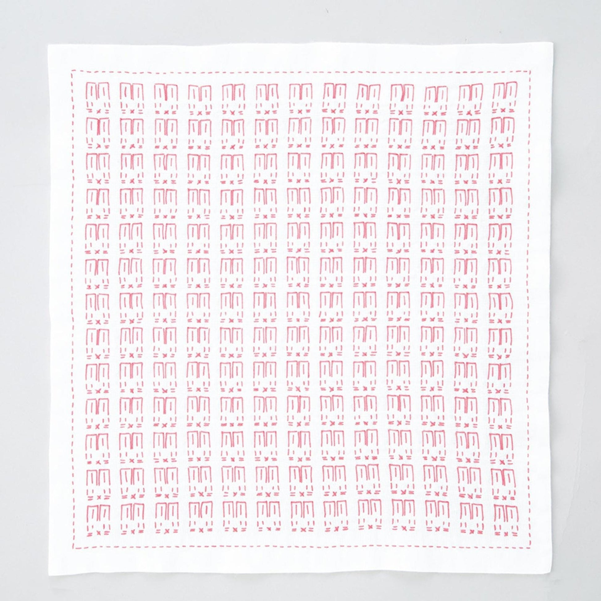 The image is a square with a repeating pattern of red and white shapes, resembling a handkerchief or a piece of fabric.