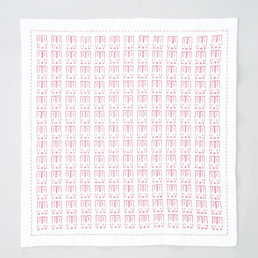 The image is a square with a repeating pattern of red and white shapes, resembling a handkerchief or a piece of fabric.