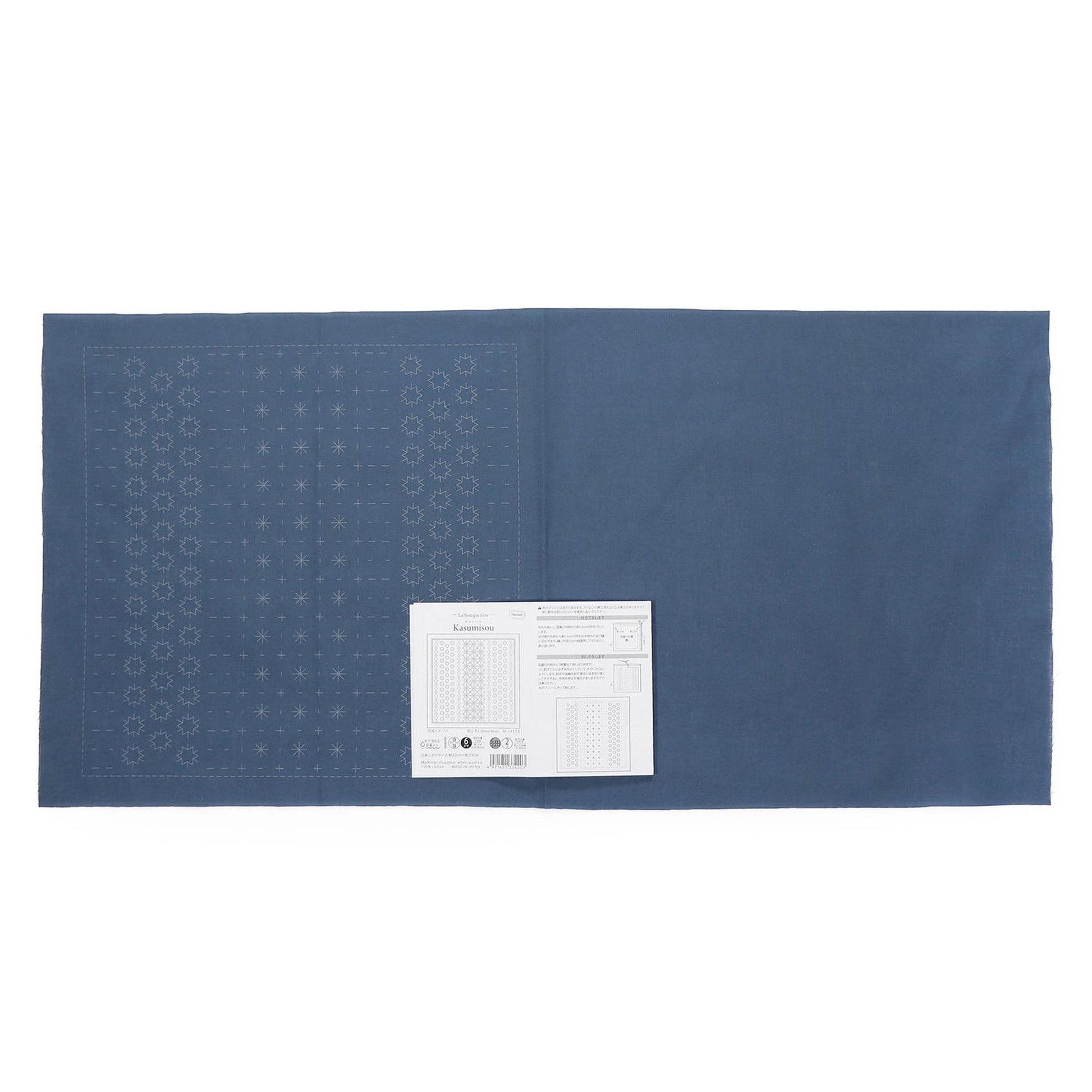 The image is a blue fabric with a white label placed on it.