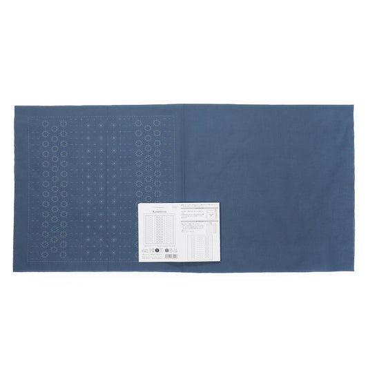 The image is a blue fabric with a white label placed on it.