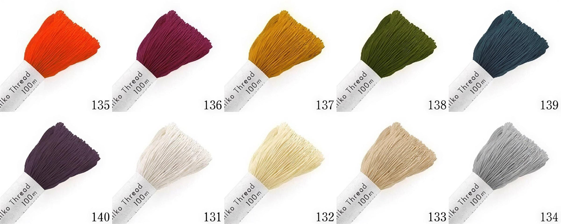 a collection of eight different colored threads, each with a label indicating the color and size.