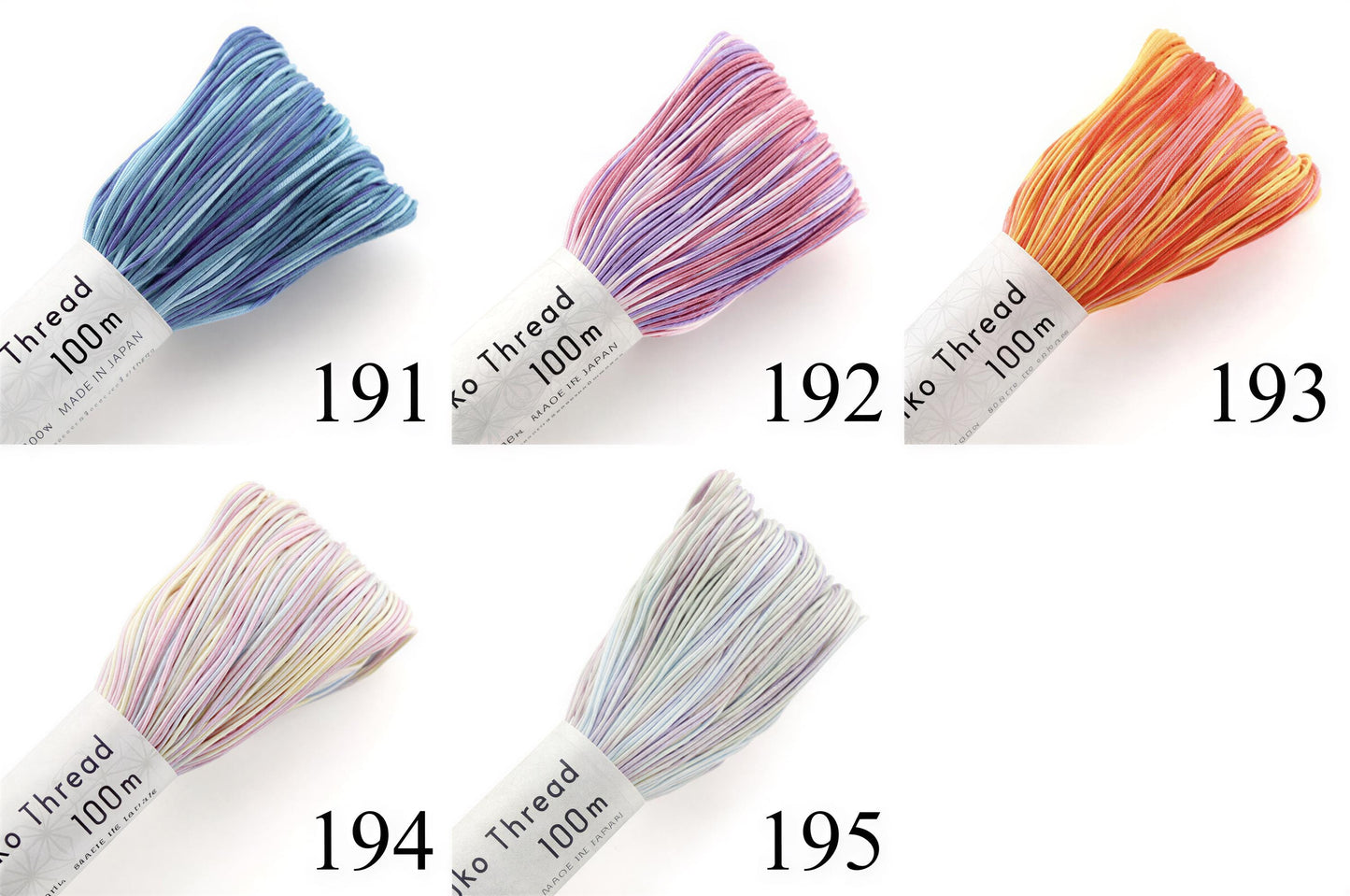 five spools of thread with different colors, each labeled with a number.