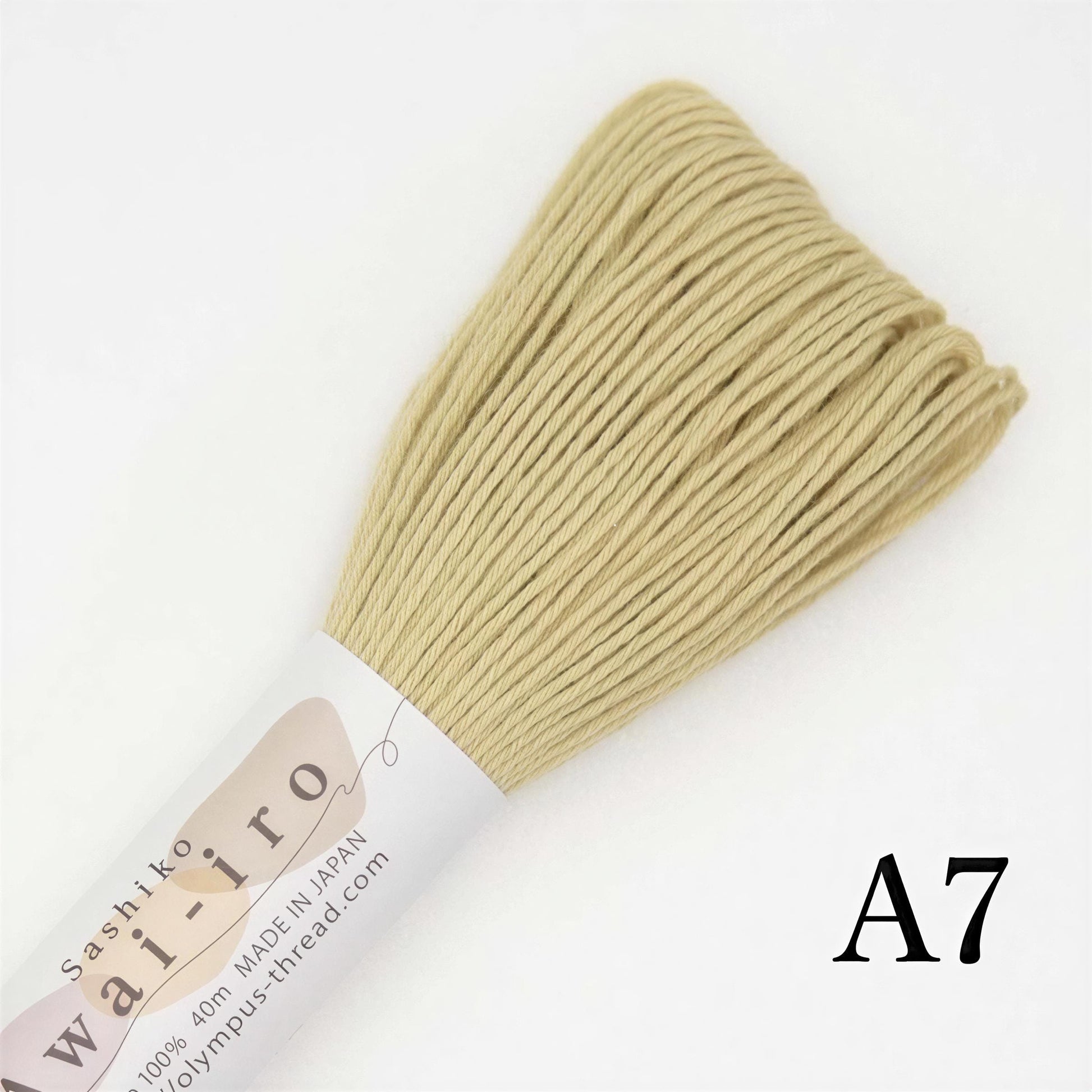 A close-up image of a spool of thread with a label that reads "A7" and "Sashiko iro".