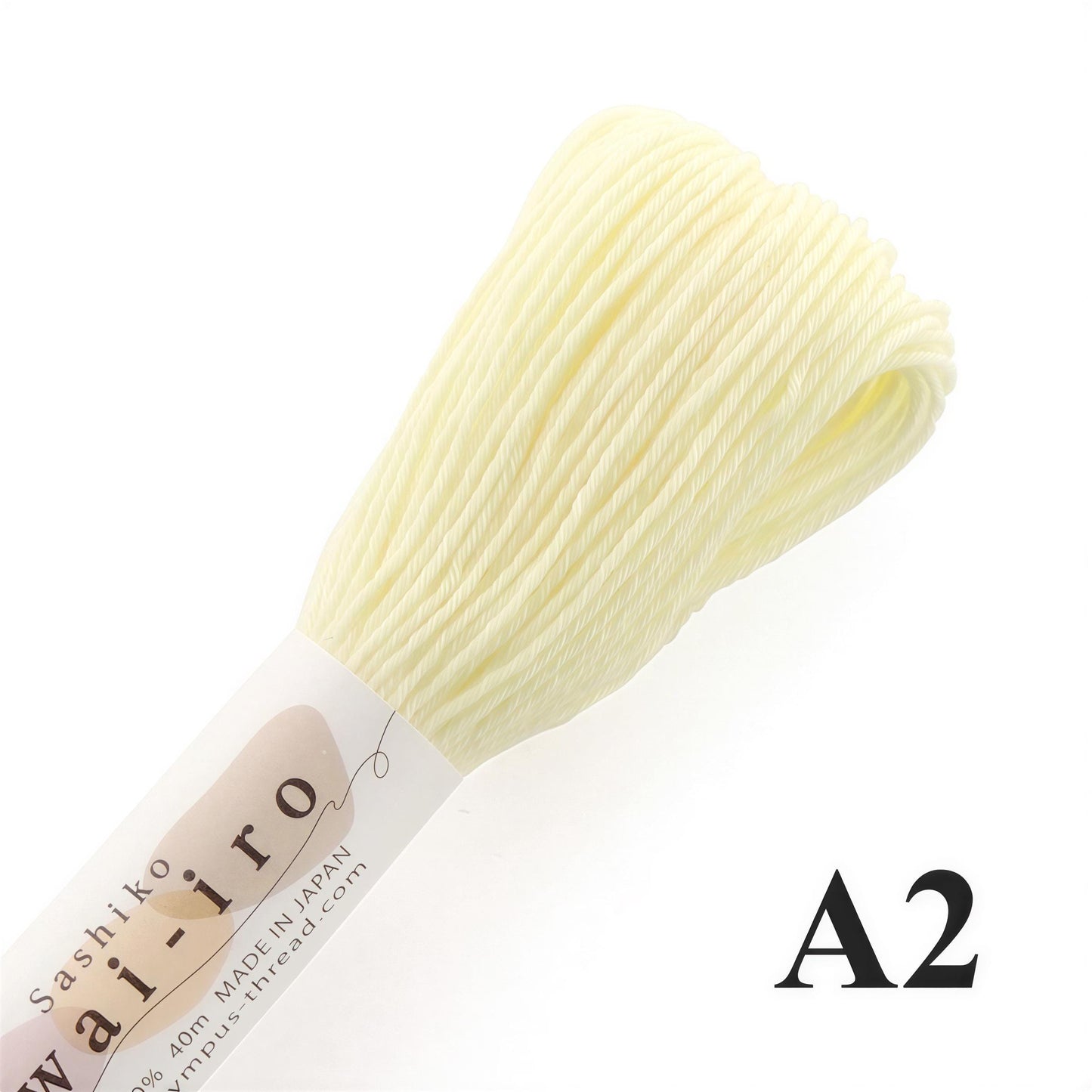 A spool of white thread with the text "A2" printed on it, against a white background.