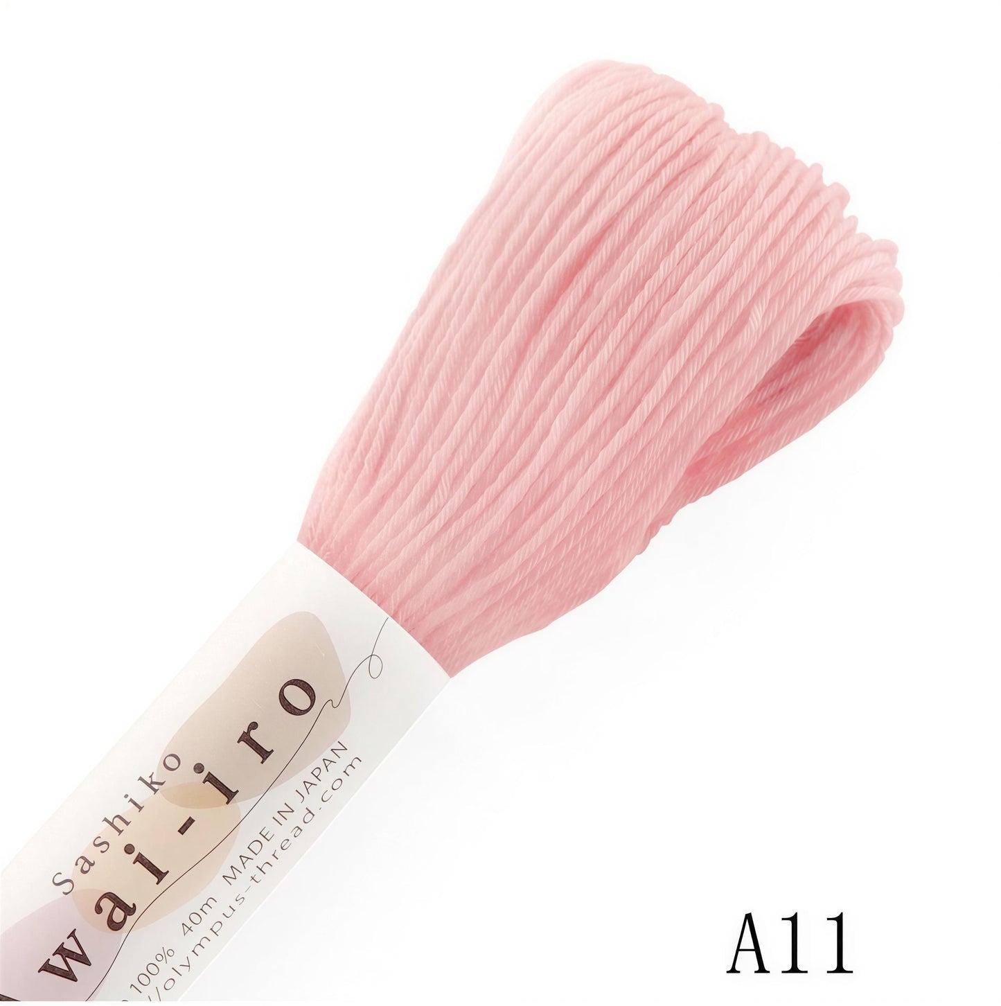 a skein of pink thread, labeled as "Wai-iro" and "100% Made in Japan", with the number "A11" printed below it.