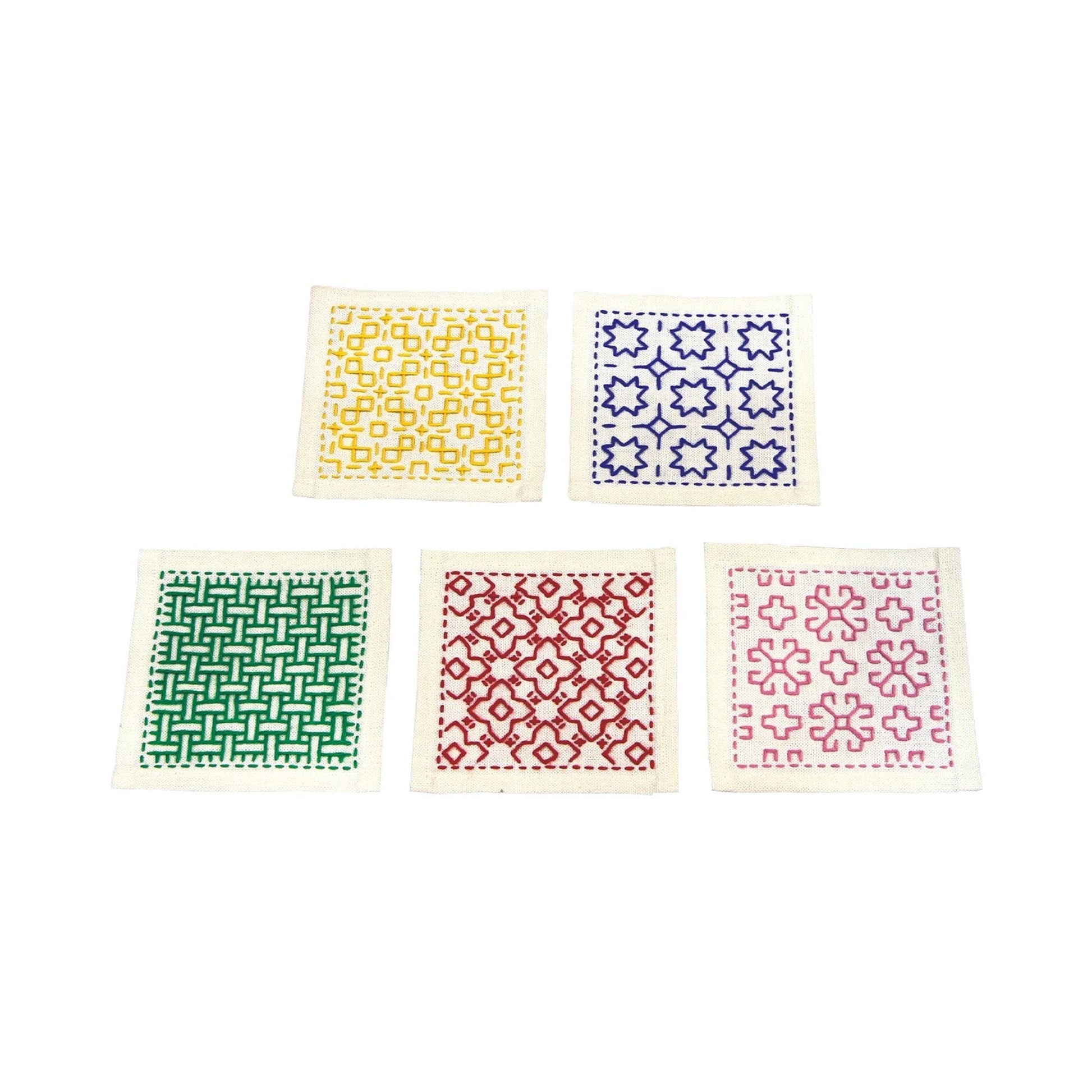 five square fabric pieces with different patterns and colors, arranged in a row.