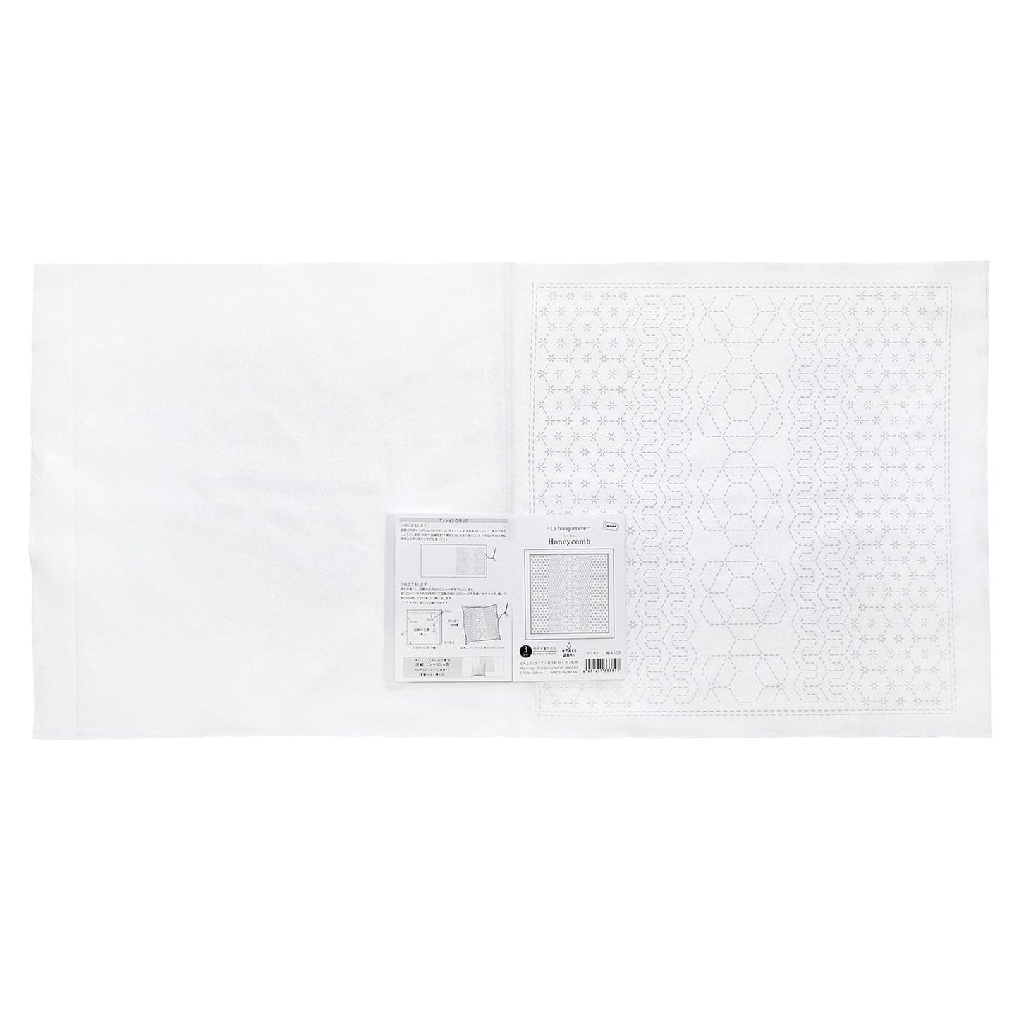 The image is a white sheet of paper with a pattern or design on it, along with some text and diagrams.