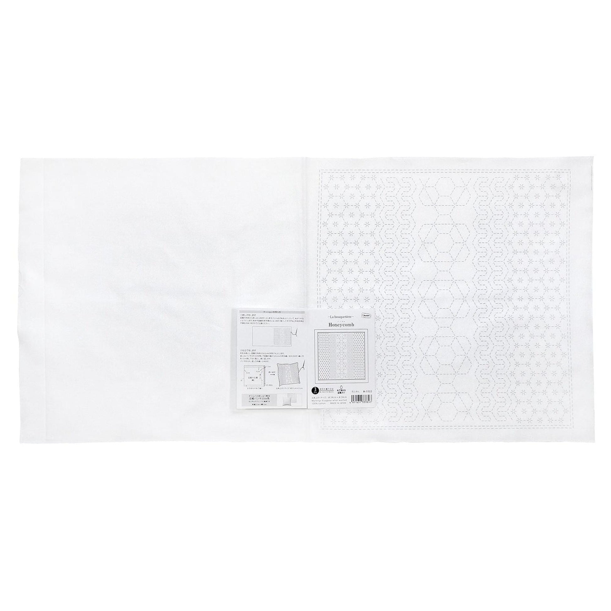 The image is a white sheet of paper with a pattern or design on it, along with some text and diagrams.