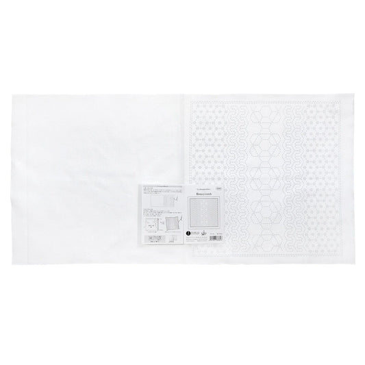 The image is a white sheet of paper with a pattern or design on it, along with some text and diagrams.