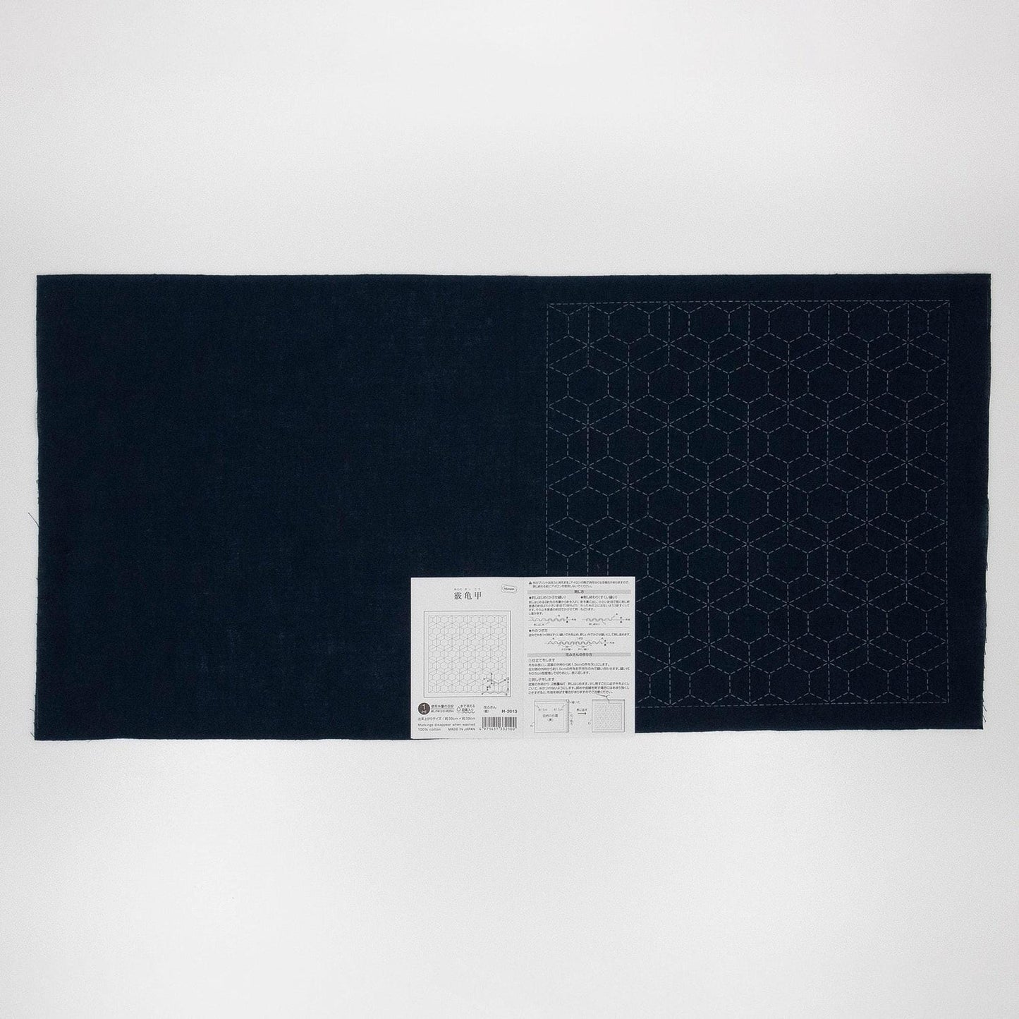 a dark blue fabric with a white pattern on it, placed on a white background.