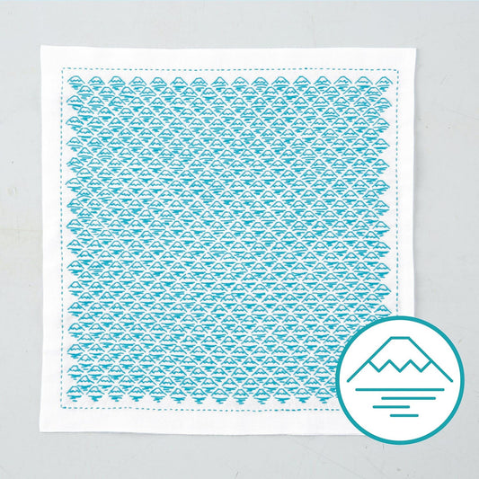 a square piece of fabric with a repeating pattern of blue triangles, creating a visually striking and intricate design.