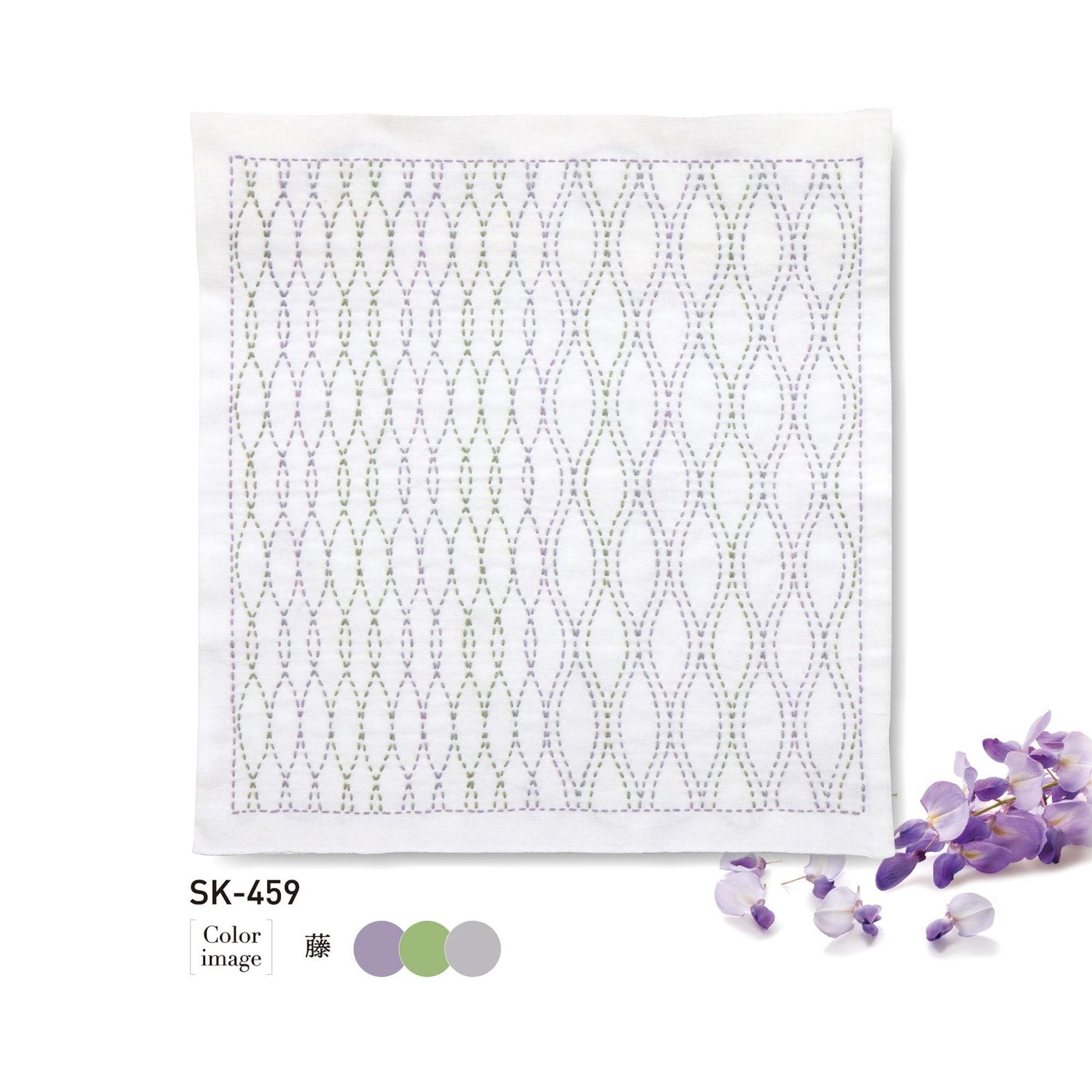 a square piece of fabric with a repeating pattern of purple and green lines, and it is accompanied by a small cluster of purple flowers.