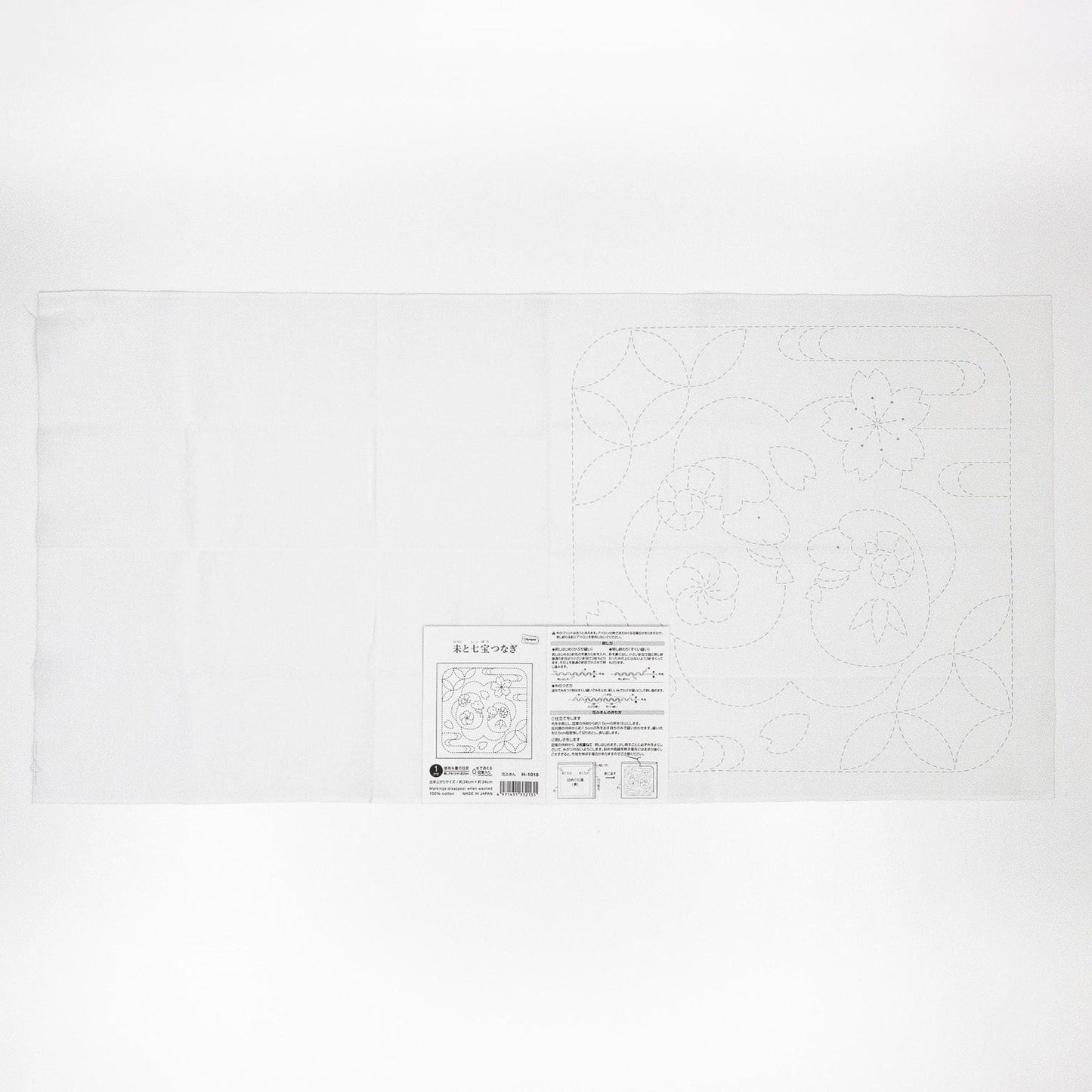 The image is a white piece of paper with a black and white design or pattern on it.