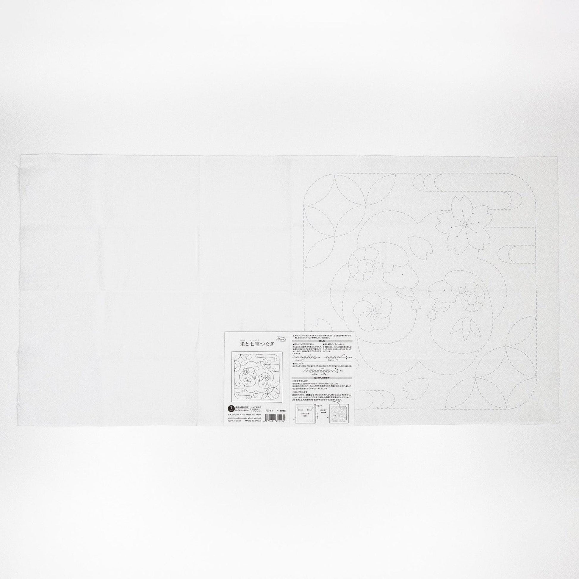 The image is a white piece of paper with a black and white design or pattern on it.