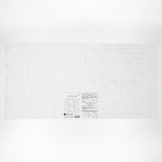 The image is a white piece of paper with a black and white design or pattern on it.
