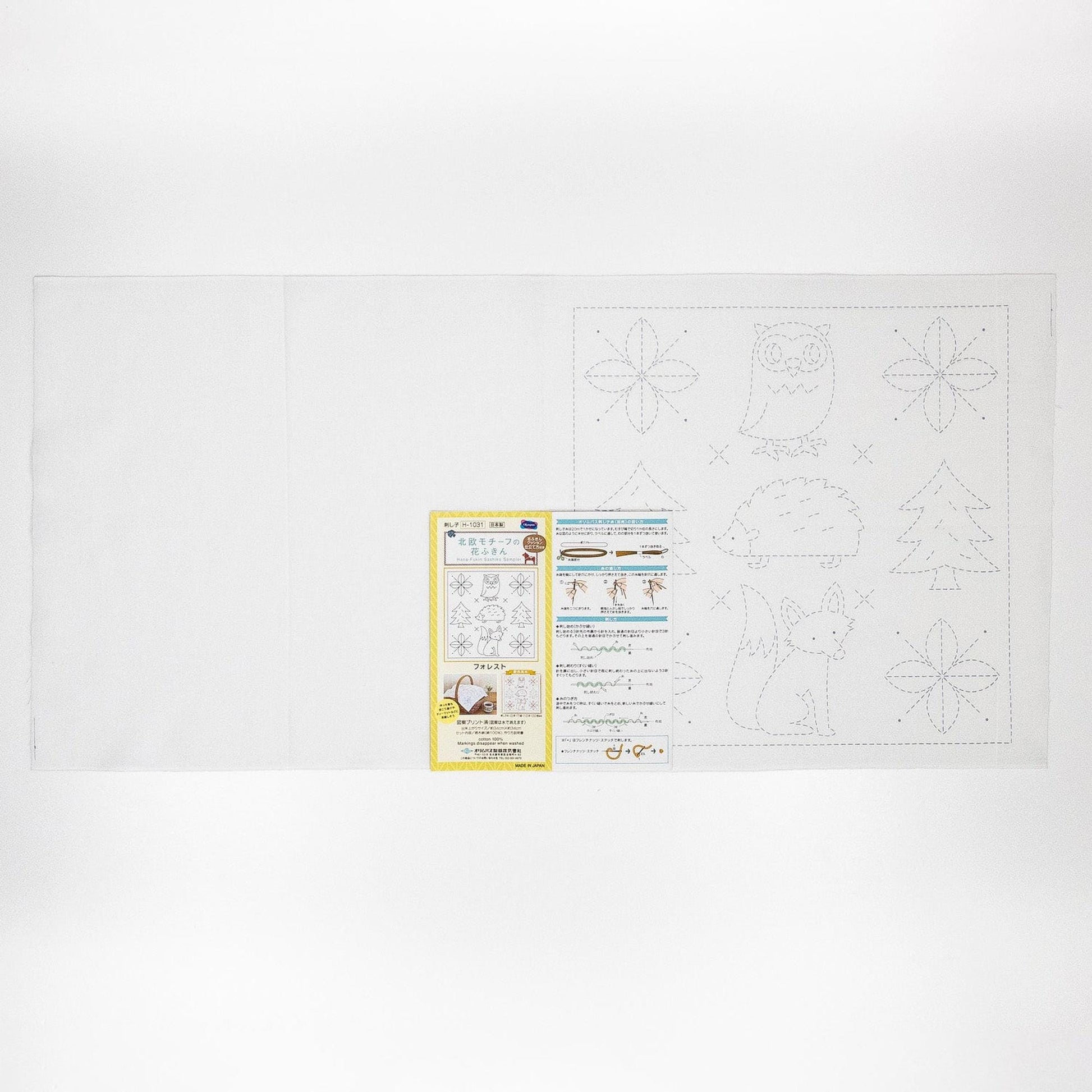 The image is a white sheet of paper with various illustrations and instructions, including a yellow and black paper with text and illustrations.