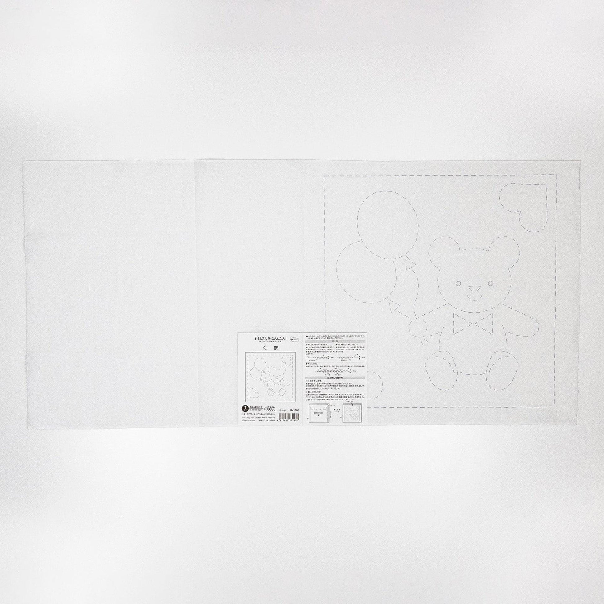 The image is a simple, plain white background with a black and white illustration of a teddy bear and some circles. There is also a small text label visible in the bottom right corner of the image.