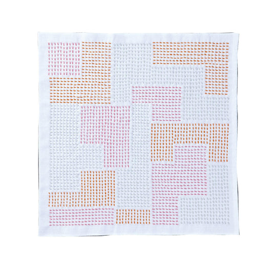The image is a square with a grid-like pattern of small circles or dots in various colors, including pink, orange, and white.