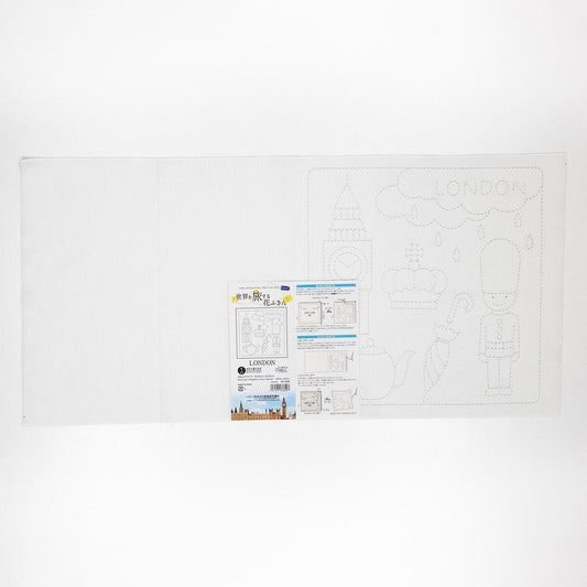 The image is a white sheet of paper with a drawing of a city and the word "LONDON" written on it. There is also a small label or instruction sheet attached to the paper, which appears to be a guide or instructions related to the drawing.