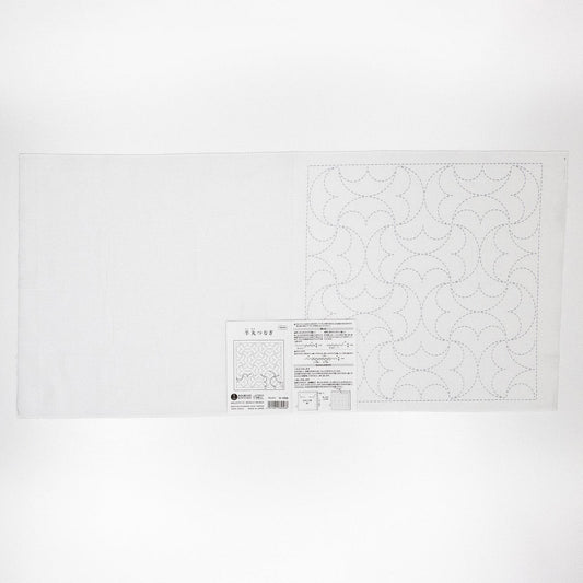The image is a white sheet of paper with a pattern or design on it, along with some text and a barcode.