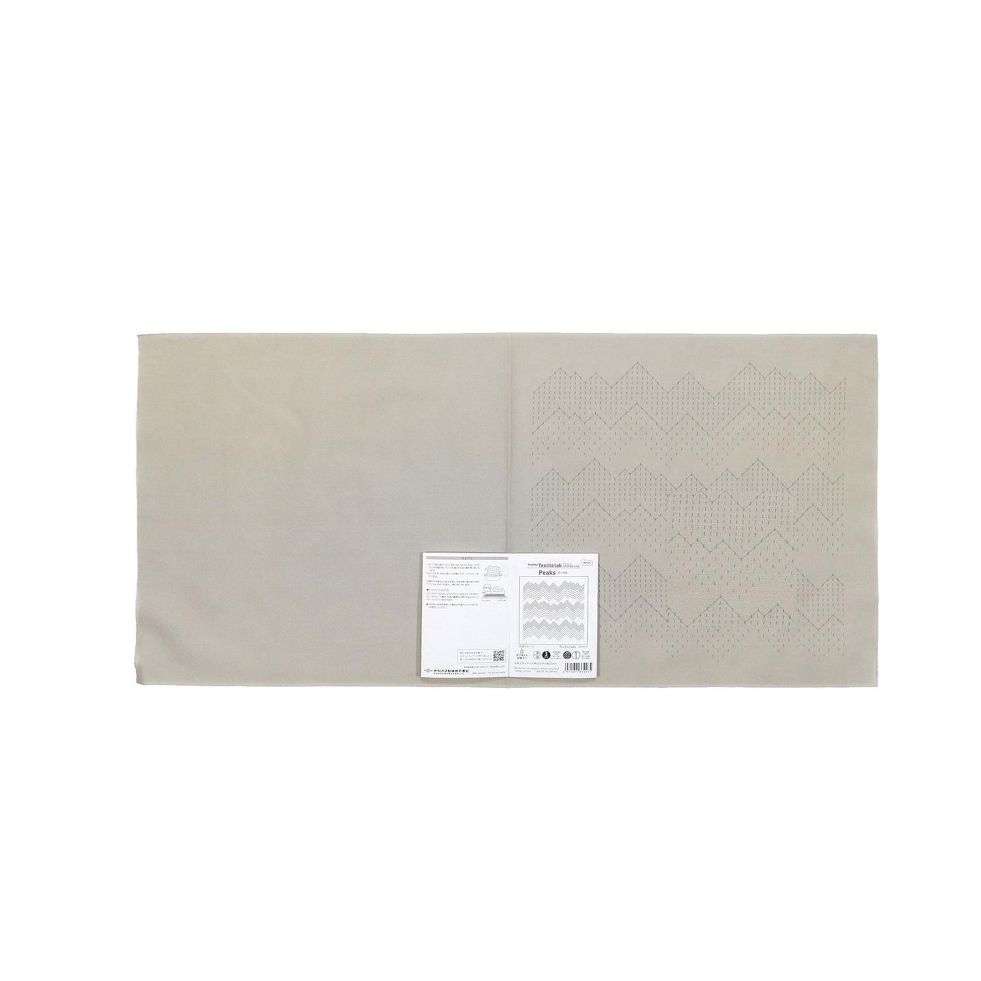 The image is a plain white rectangular sheet of paper with a small white label attached to it.