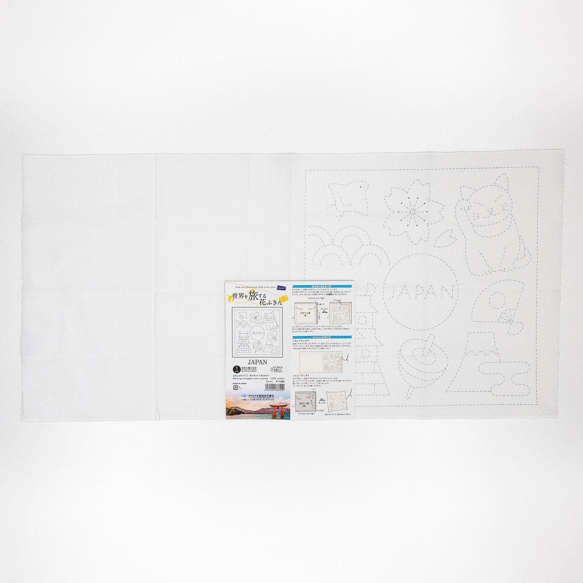 The image is a white sheet of paper with a drawing of a cat and various other shapes and symbols, along with some text and instructions.