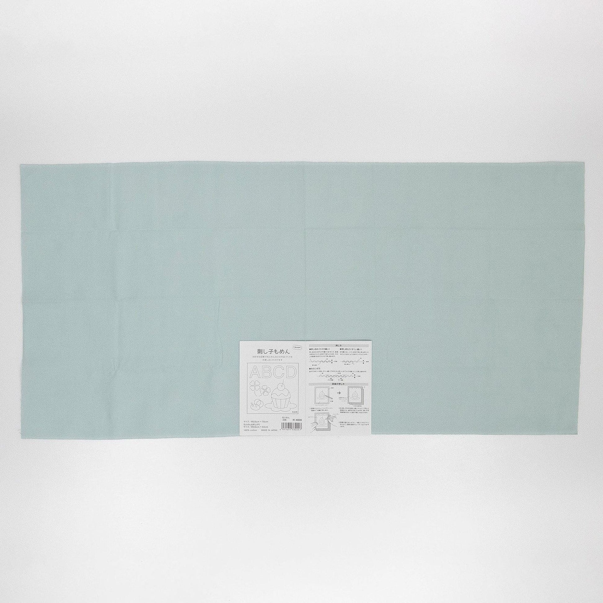 A light blue rectangular sheet of paper with text and diagrams on it.