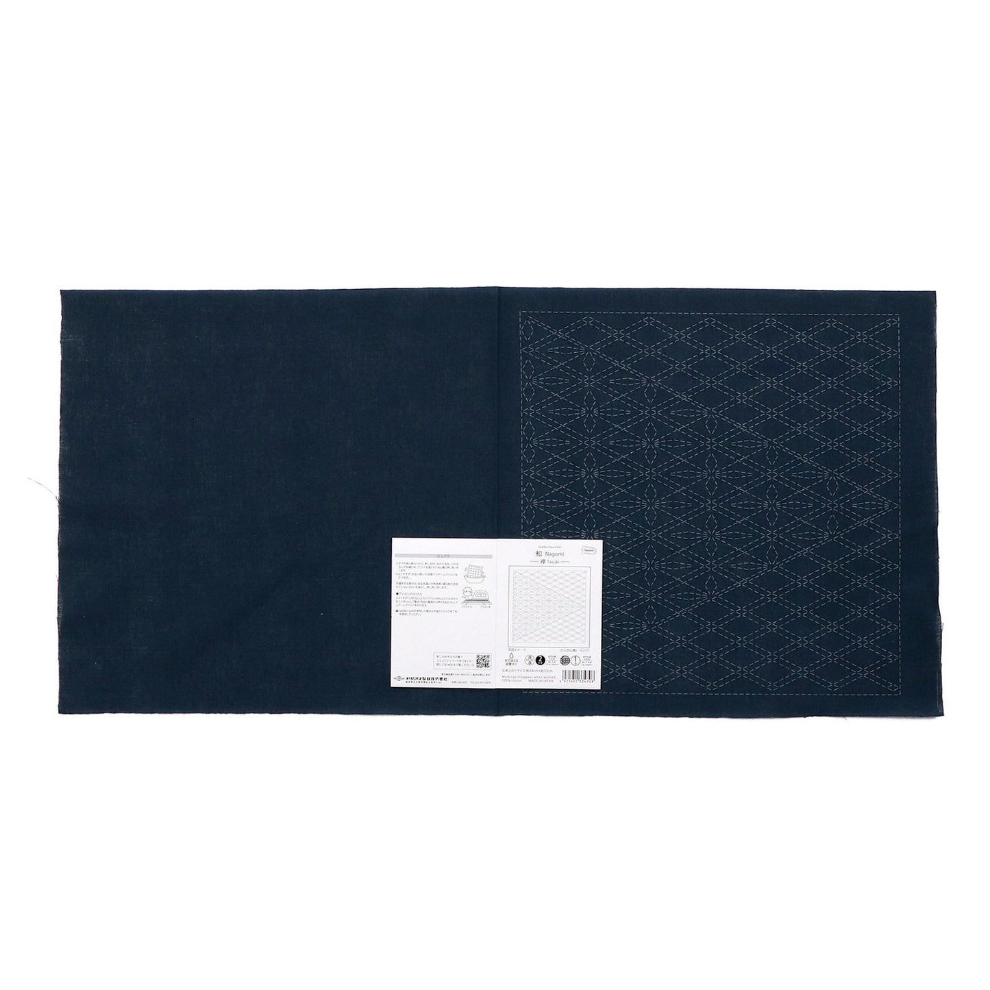 The image is a dark blue fabric with a white label attached to it, which appears to be a sewing or crafting material.