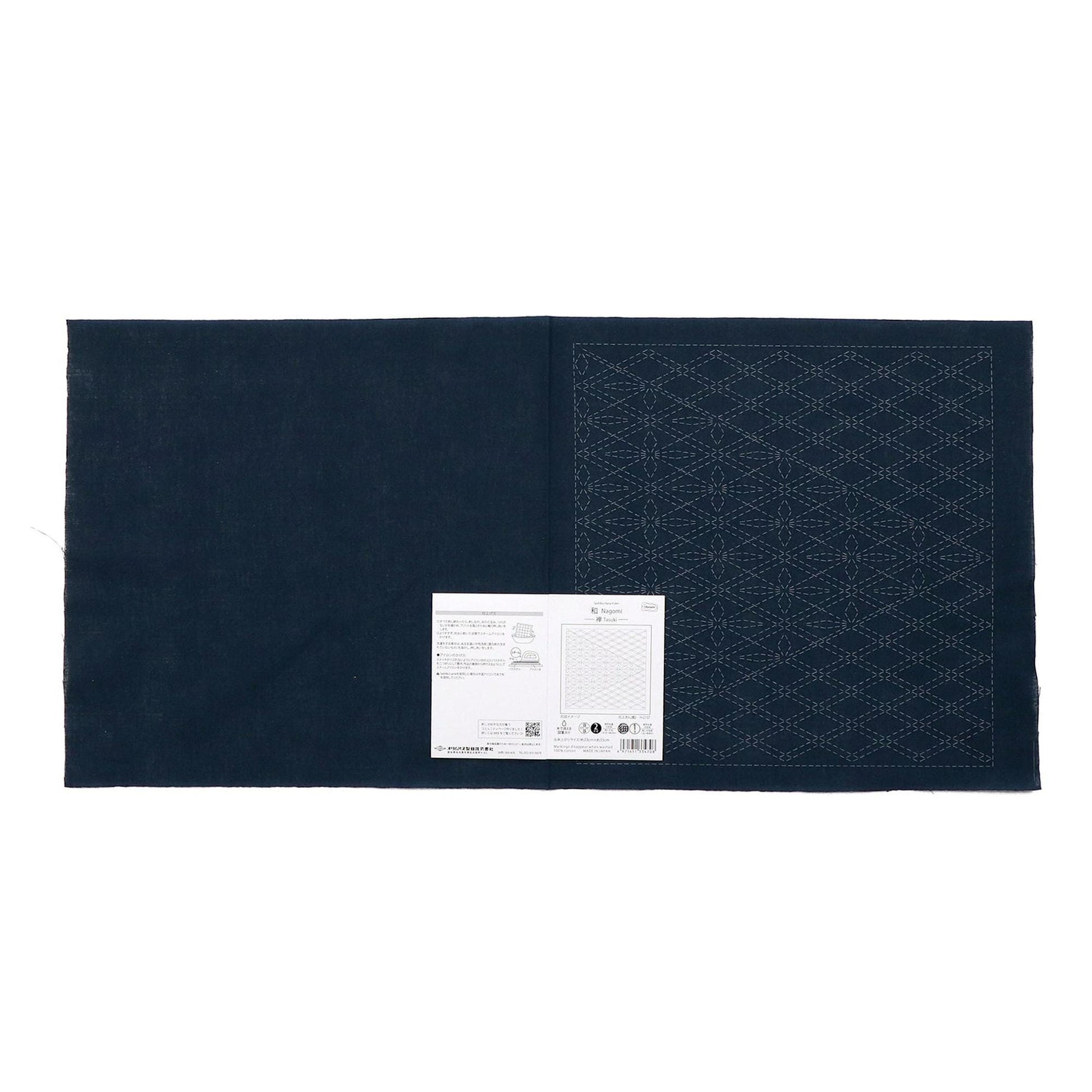 The image is a dark blue fabric with a white label attached to it, which appears to be a sewing or crafting material.