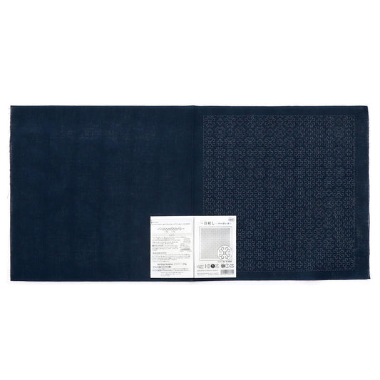 The image is a dark blue fabric with a white label attached to it, which appears to be a price tag or informational label.