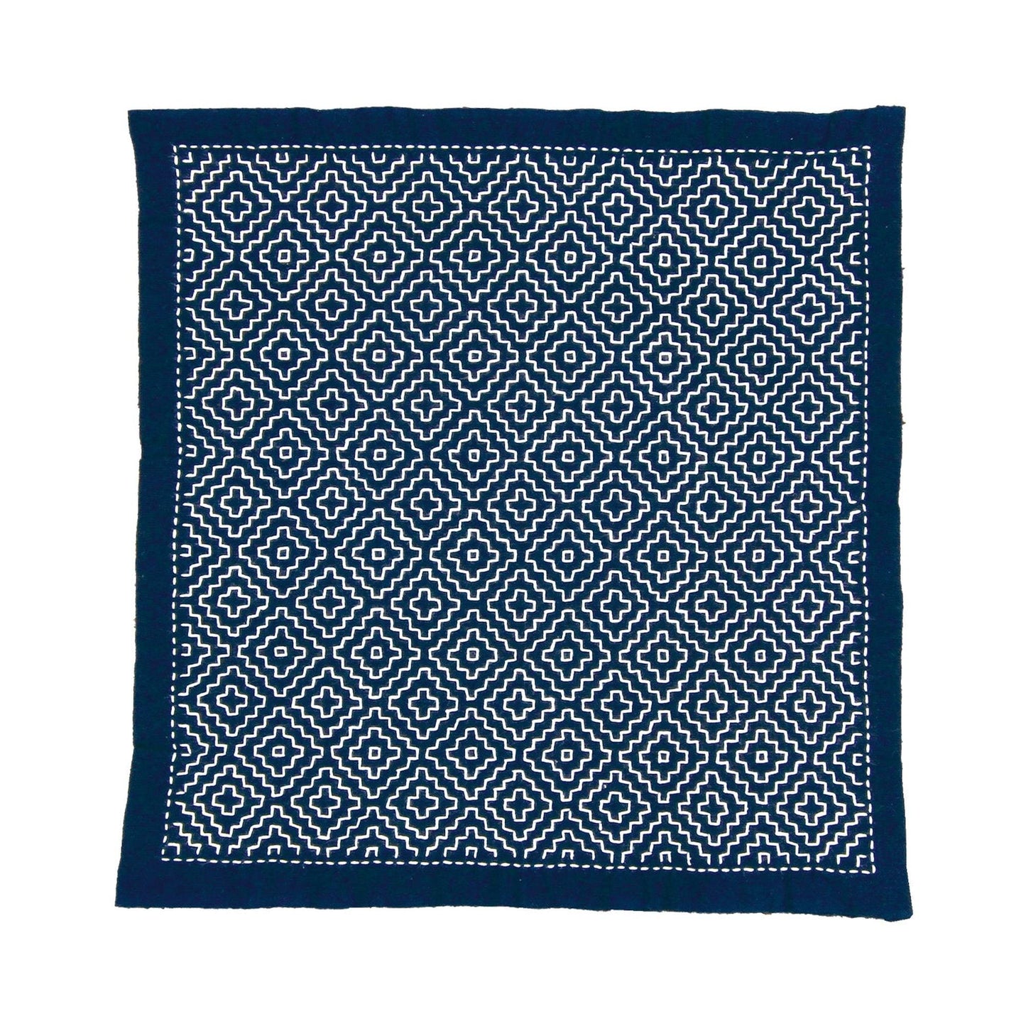 a square-shaped fabric with a repeating pattern of white and navy blue geometric shapes, creating a visually striking and intricate design.