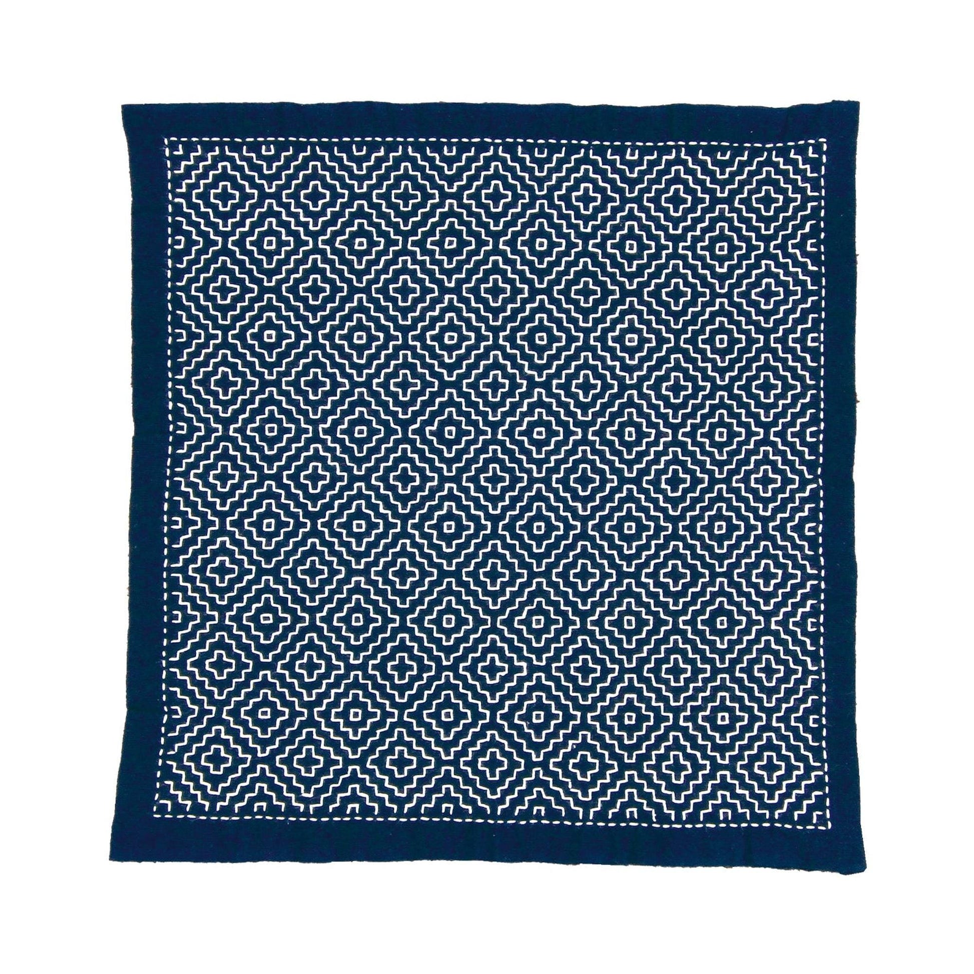 a square-shaped fabric with a repeating pattern of white and navy blue geometric shapes, creating a visually striking and intricate design.
