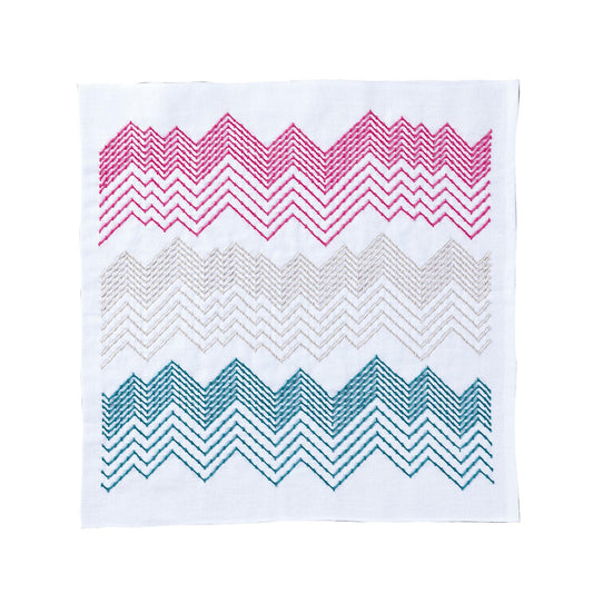 a square with a zigzag pattern in pink, blue, and green colors.