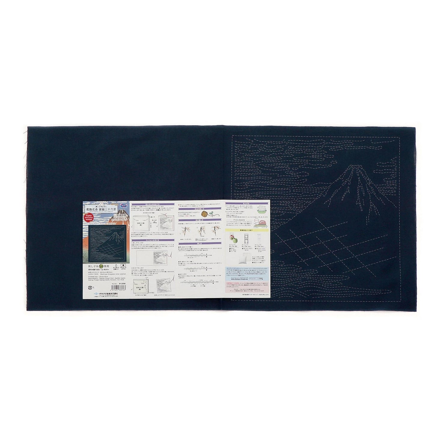 The image is a black and white photograph of a sewing kit with instructions and diagrams.