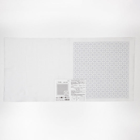 The image is a white sheet of paper with a black and white geometric pattern on it.