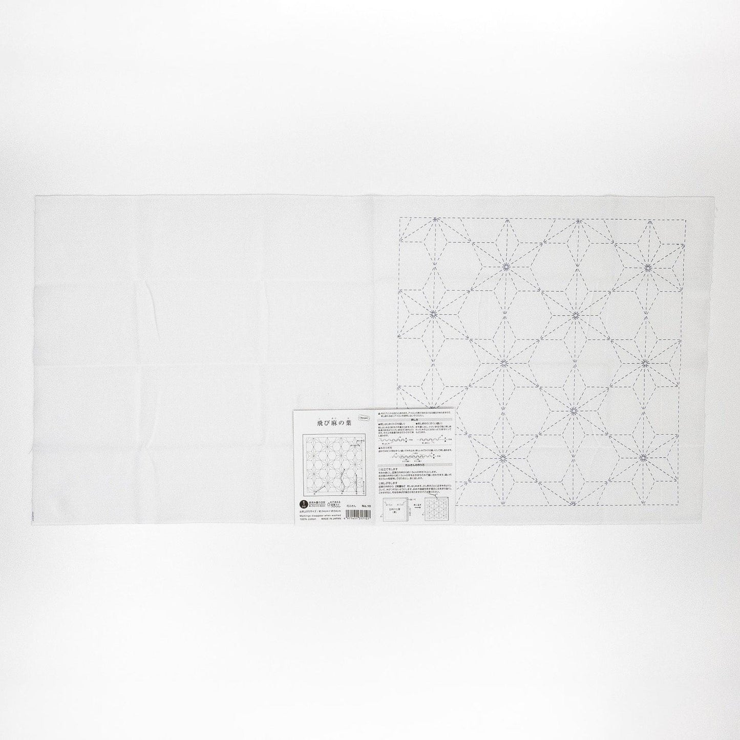 The image is a white sheet of paper with a detailed pattern or design on it, along with some text or instructions below it.